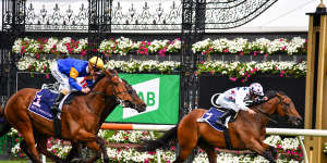 Jockey Luke Currie steers Sunlight to victory from Santa Ana Lane,ridden by Mark Zahra,in the Gilgai Stakes at Flemington on Saturday.