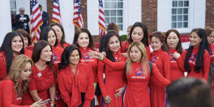 Women in Save America PAC dresses before a speech by Donald Trump during an event at Trump National Golf Club in Bedminster,New Jersey on June 13.