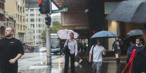 Sydneysiders were forced to run for cover amid heavy downpours in the CBD.