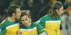 Lucas Neill shows his appreciation for Brett Holman after his goal put Australia 2-0 up.