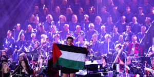 A Pro-Palestinian protester interrupts the Carols by Candlelight concert in Melbourne on Sunday.