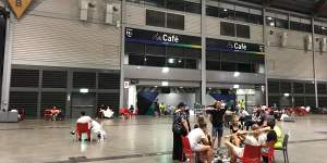 Temporary home:Affected residents inside the Sydney Showgrounds'exhibition hall late on Monday evening. 