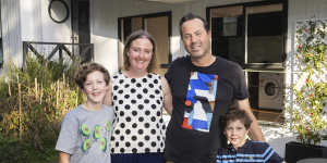 Jason and Melinda Kilgour with their children Will,10,and Harvey,6,at their Small Homes Service home in Blackburn.