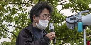 A protester speaks during a protest against the Tokyo Olympics,where concerns lingers over the feasibility of hosting the event amid a pandemic. 
