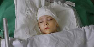 Volodymyr Baklanov,7,in intensive care at Kharkiv No.4 Emergency Hospital. 