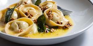 Cappelletti stuffed with four cheeses on top of cavolo nero purée with a parmigiano fondue,burnt-butter sage and hazelnuts.