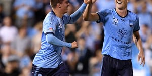 Dream come true:Cameron Devlin high-fives Brandon O'Neill for setting him up with his maiden A-League goal.