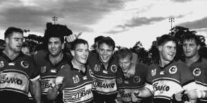 Billy Moore (far left) celebrates a victory with Bears teammates in 1994.