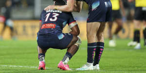Filipo Daugunu and Lachie Anderson of the Rebels react at the final whistle.