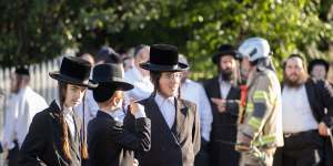 Congregants outside the synagogue on Friday morning.