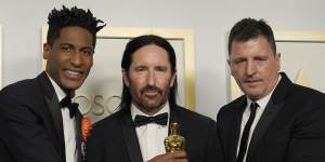 Jon Batiste,Trent Reznor and Atticus Ross with their Oscar for original score for Soul.