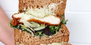 Schnitty sandwich with crispy chicken schnitzel,herby mayonnaise,mixed lettuce and caramelised carrot.