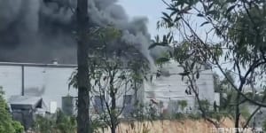 'Just a bummer':Gold Coast surfboard factory erupts in flames