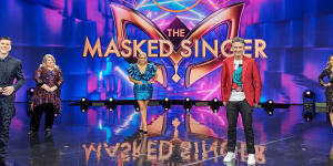 A socially distant Dannii Minogue (right) on The Masked Singer set following her stay in quarantine.