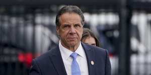 Andrew Cuomo prepares to board a helicopter after announcing his resignation. 