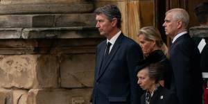 Vice Admiral Timothy Laurence,Sophie,Countess of Wessex,and Prince Andrew,Duke of York,look on as Princess Anne,Princess Royal,curtseys.