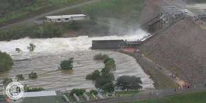 Water flows out of the Ross River Dam in Townsville after the floodgates were opened on Sunday night