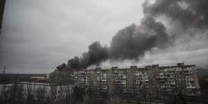 Smoke rises after shelling by Russian forces in Mariupol on Friday,