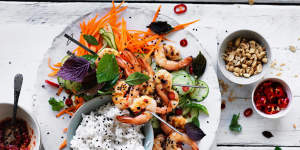 Coconut rice with quick pickled vegetables and prawn skewers.
