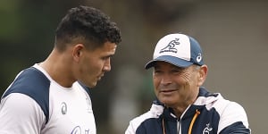 Wallabies coach Eddie Jones talks with Izzy Perese at training in Melbourne.