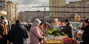 Better times ... shoppers visit a weekly street market in Troieshchyna,a suburb of Kyiv,in November 2021.