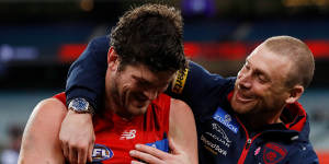 Angus Brayshaw,who has retired from football on medical advice,with coach Simon Goodwin.