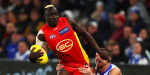 Gold Coast’s Mabior Chol is tackled.