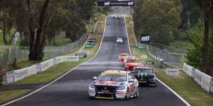 Shane van Gisbergen leads the field down Conrod Straight at Mount Panorama earlier this year.