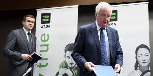 President-elect of WADA Witold Banka and Reedie arrive at the press conference to announces the sanctions.