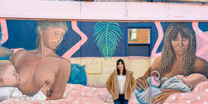Artist Caroline Lejeune in front of her mural,“Breastralia”,in Collingwood.