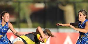 Maddy Brancatisano of the Tigers is tackled by Emma Swanson of the Eagles during the 2022 AFLW Round 07 match between the West Coast Eagles and the Richmond Tigers at Mineral Resources Park on February 19,2022 In Perth,Australia.