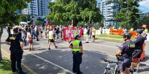 Vaccine supporters have a jab at anti-vax protesters at Brisbane rally