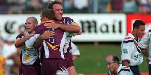 Broncos icons Allan Langer,Darren Lockyer and Gorden Tallis embrace after defeating Sydney City Roosters at then-ANZ Stadium in 1998. 