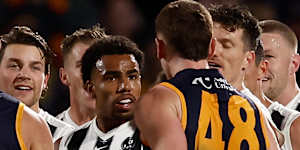 Isaac Quaynor and Mark Keane exchange words after the half-time siren.