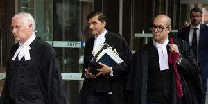 Bret Walker SC (left),and colleagues Arthur Moses,SC,and Phillip Sharp leave the Federal Court in Sydney on Monday.