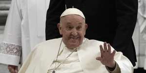 Pope Francis waves after presiding over the Easter Vigil celebration.