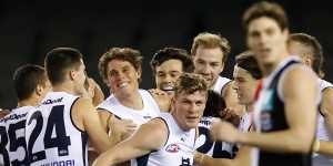 Charlie Curnow (centre) was all smiles in his return to action with the Blues.