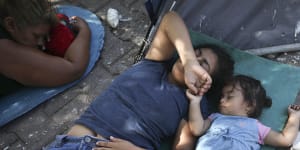 US-bound migrants rest at a camp near an immigration centre in Matamoros,Mexico.