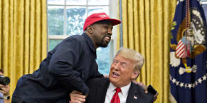 West shakes hands with Trump during a meeting in the Oval Office in 2018.