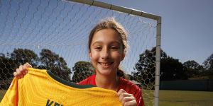 Zara Borcak at Old Bridge FC with the jersey given to her by Sam Kerr at the Australia vs France match in Brisbane on Saturday.