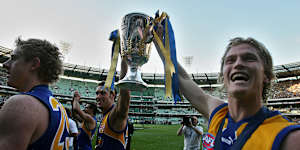 Adam Selwood (right) with the AFl Premiership Cup following West Coast’s 2006 win.