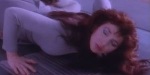 Kate Bush in the Running Up That Hill music video.