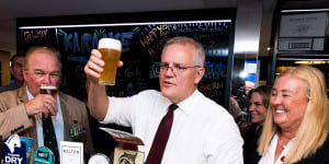 Morrison visited Cazalys Palmerston Club on Anzac Day where he pulled beers for locals and played a game of two up.