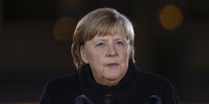 German Chancellor Angela Merkel revealed her punk side at the Defence Ministry during the Grand Tattoo,a ceremonial send-off for her,in Berlin. 