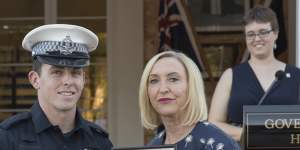 Constable Rolfe receiving a bravery cross in 2019 from NT Administrator Vicki O’Halloran.