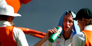 Australian batsman Marnus Labuschagne shielding from the heat at a Test match in Perth in December 2019.
