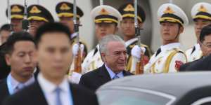 Brazilian President Michel Temer is treated to a guard of honour in Beijing last year.