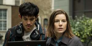 Hacker Roddy Ho (Christopher Chung) on the job with Shirley Dander (Aimee-Ffion Edwards) in Slow Horses.