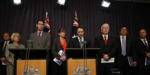 Home Affairs Minister Jason Clare and Sports Minister Kate Lundy with sporting code representatives at the infamous"blackest day"press conference in Canberra on February 7,2013.