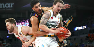 JackJumpers Josh Adams,front,and Jarred Bairstow collide with Shea Ili of United during the third semi-final encounter.